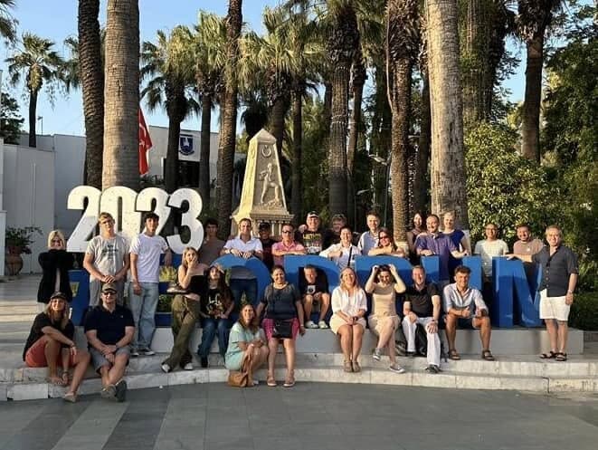 The group gathered around a big 2023 sign