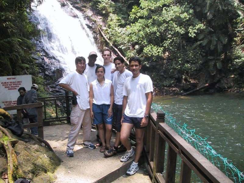 A group of us in front of a jungle waterfall
